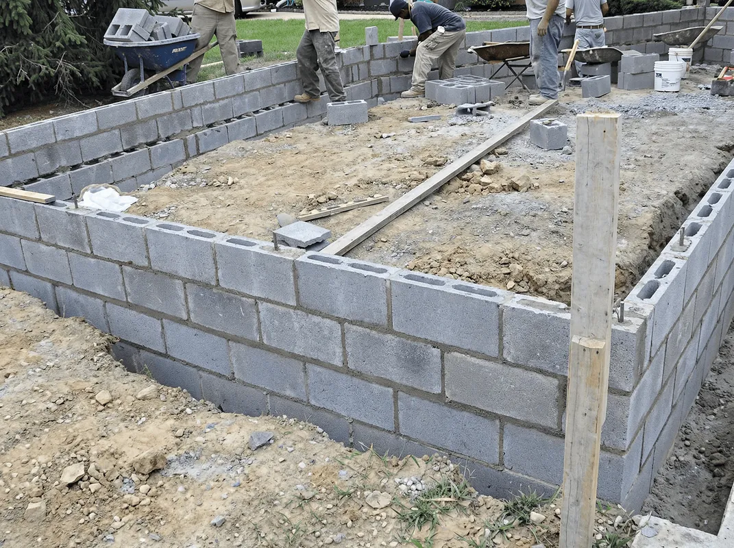 Professionals building a foundation with blocks in Omaha, NE
